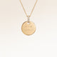 Personalised round gold necklace with white zirconia and engraved initials and date – room for text, coordinates or handwriting on the front and back