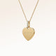 Personalized heart-shaped gold necklace with white zircons and space for engraving of text, coordinates or handwriting on the front and back