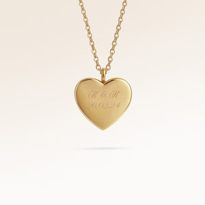Personalized heart-shaped gold necklace with space for engraving of text, coordinates or handwriting on the front and back