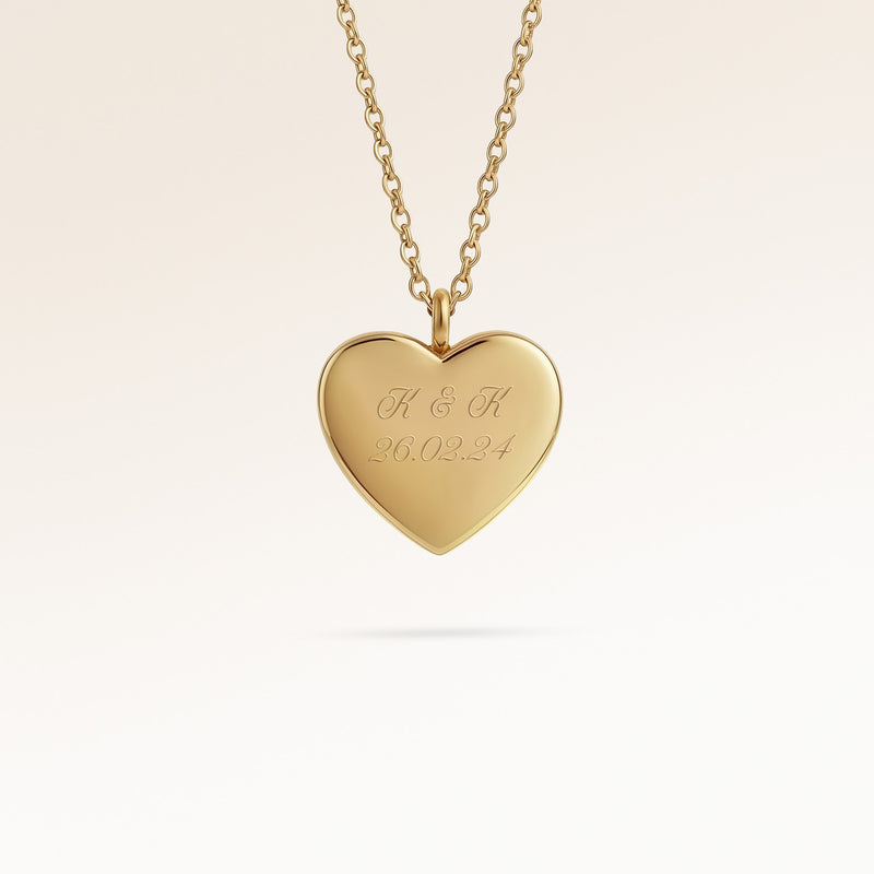 Personalized heart-shaped gold necklace with space for engraving of text, coordinates or handwriting on the front and back