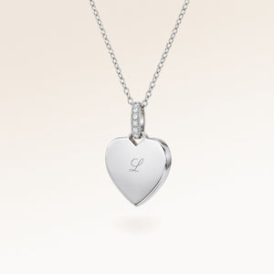 Personalized heart-shaped silver necklace with white zircons and space for engraving of text, coordinates or handwriting on the front and back
