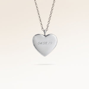 Personalized heart-shaped silver necklace with space for engraving of text, coordinates or handwriting on the front and back