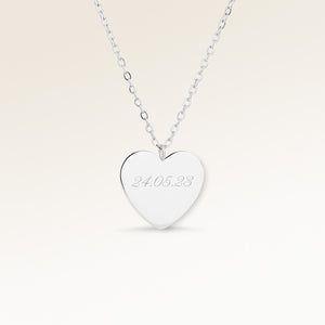 Personalized heart-shaped silver necklace with space for engraving of text, coordinates or handwriting on the front and back