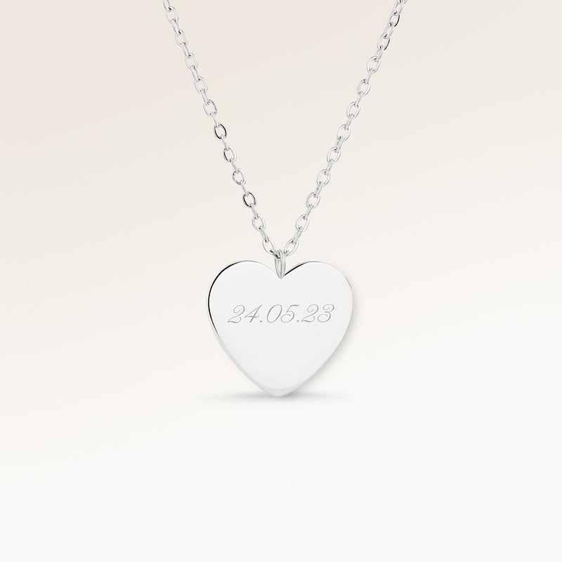Personalized heart-shaped silver necklace with space for engraving of text, coordinates or handwriting on the front and back