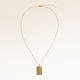 The full rectangular gold necklace with a soft melted look laid out, with a fine adjustable gold chain and a pendant for personal engraving