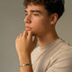 Model wearing personalized bar bracelet for men in silver with space for engraving of text or handwriting
