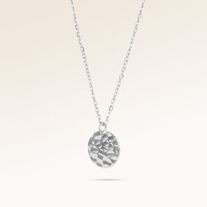 Round silver necklace with rippled wave surface side view, space for engraving on back