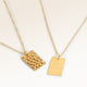 Personalized square gold necklace with rippled wave surface and space for engraving of text, coordinates or handwriting on the back