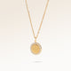 Personalized round gold necklace with white zircons along the edge and space for engraving of 8 characters on one line on the front