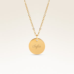 Personalized round gold necklace with space for engraving of text, coordinates or handwriting on the front and back
