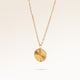 Round gold necklace with ribbed sunburst pattern side view, space for engraving on back