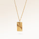 Square gold necklace with ribbed sunburst pattern side view, space for engraving on back