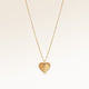 Personalized heart-shaped gold necklace with ribbed sunburst pattern centered and minimalist pendant with space for engraving on back.